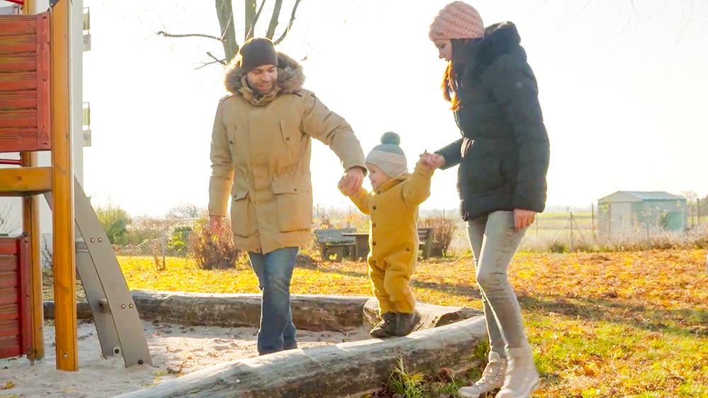 DEBATIN family walking on playground