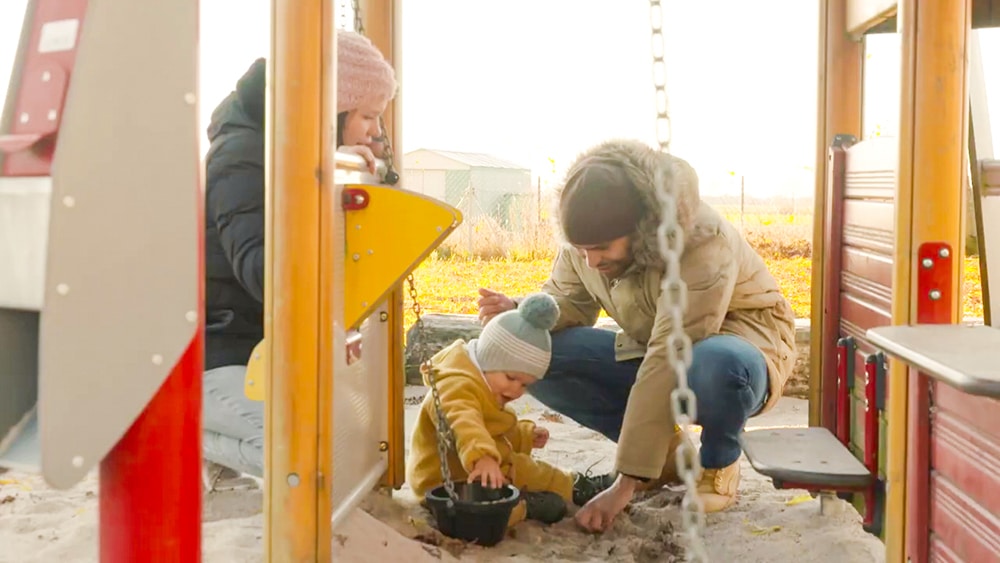 DEBATIN Family Father with child in the sandpit